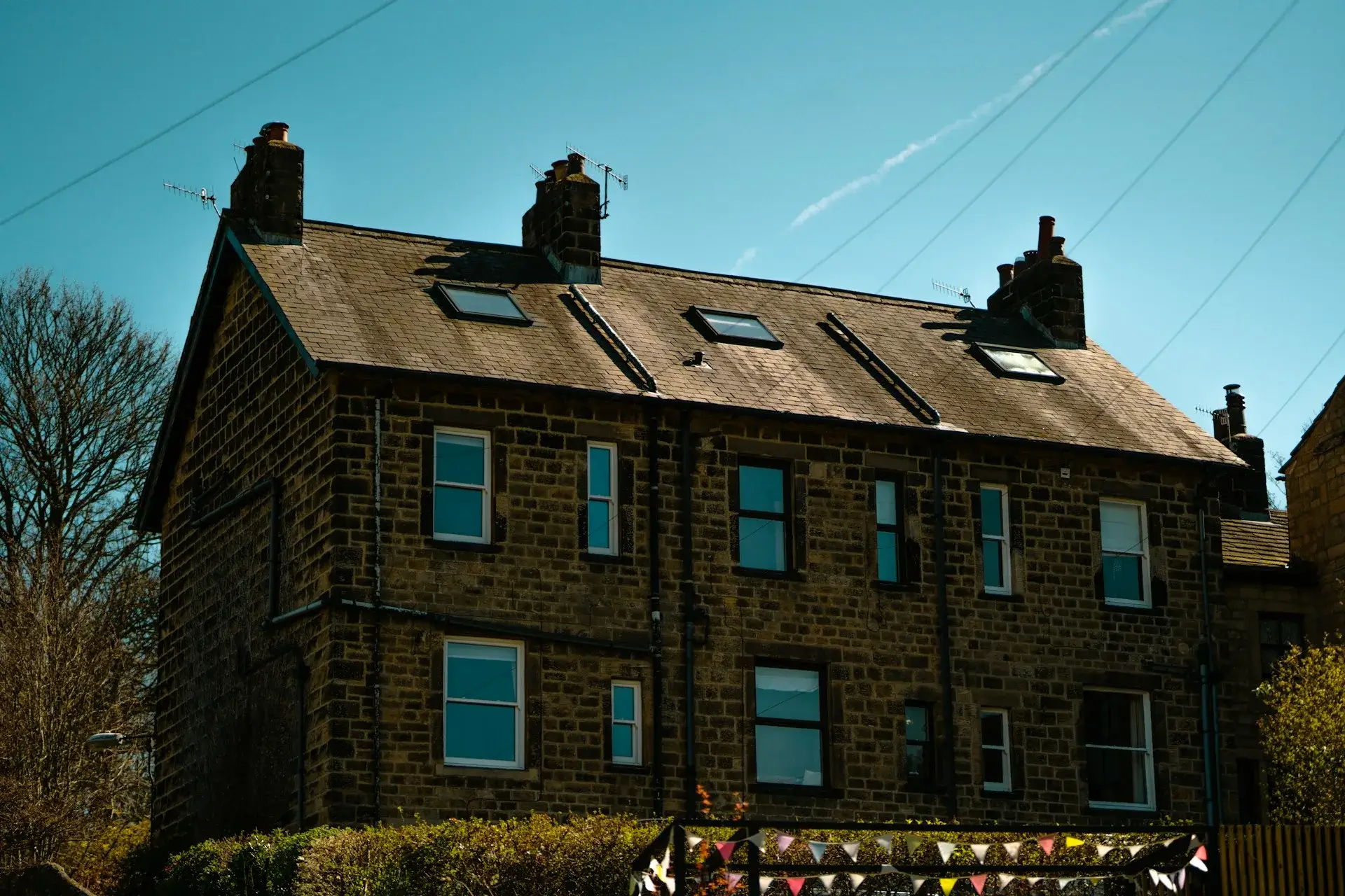 Tiled roof on a residential property in Northampton showing weathering and discolouration before professional roof cleaning
